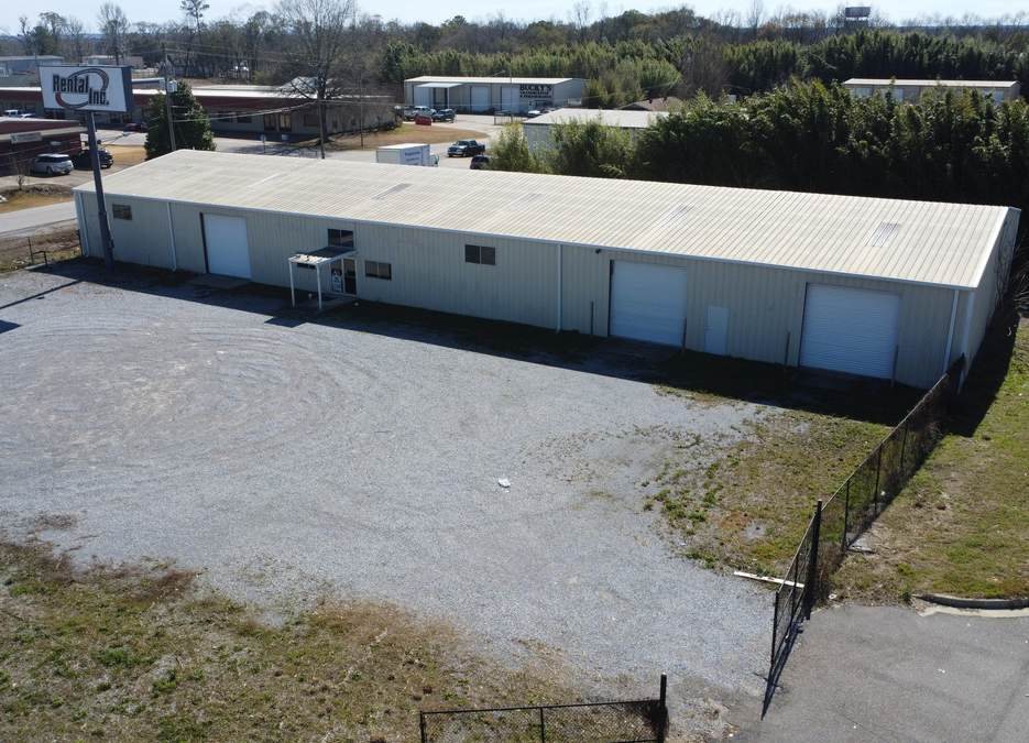 Aerial view of 1951 Market St flex building and fenced yard, Millbrook AL